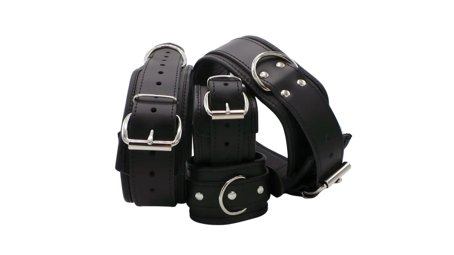 Set aus Oberschenkelfesseln und Handfesseln aus schwarzem Leder mit Polsterung und Metallringen – hochwertig für BDSM-Fesselspiele